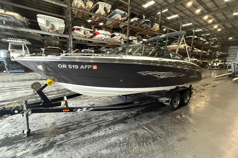 Slide: The Image of 2016 Monterey 224FS boat on trailer in indoor storage facility. - 3