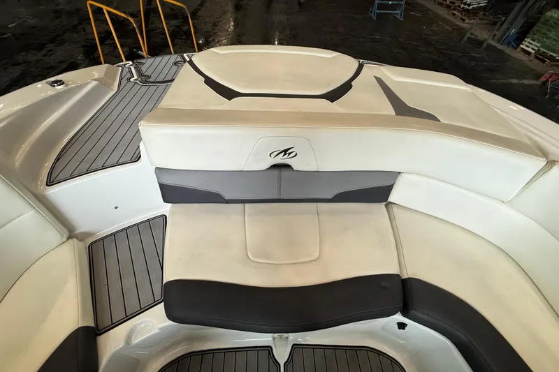 Slide: The Image of 2016 Monterey 224FS boat interior with cushioned seating and sleek design. - 8