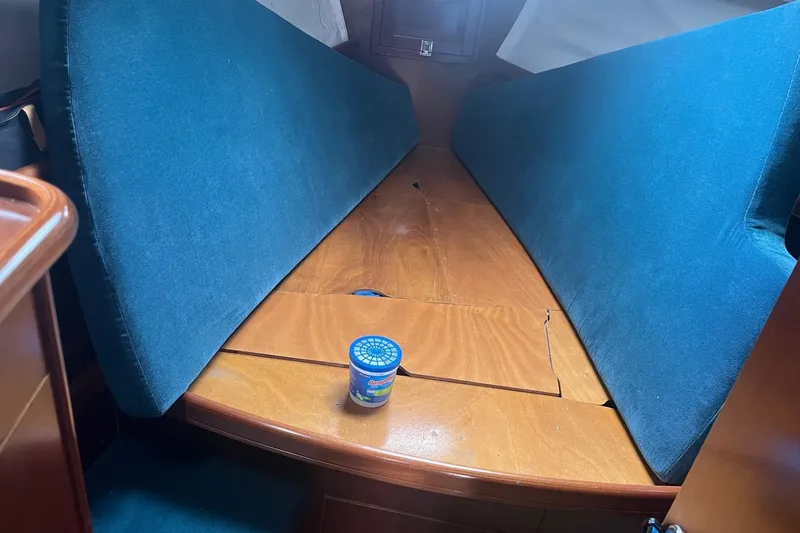Slide: The Image of Interior cabin of 1999 Beneteau Oceanis 381 sailboat with blue cushions. - 8