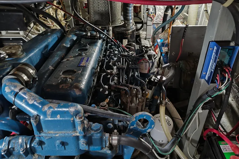 Slide: The Image of Engine room of a 1986 CHB Senator with blue engine cover. - 48