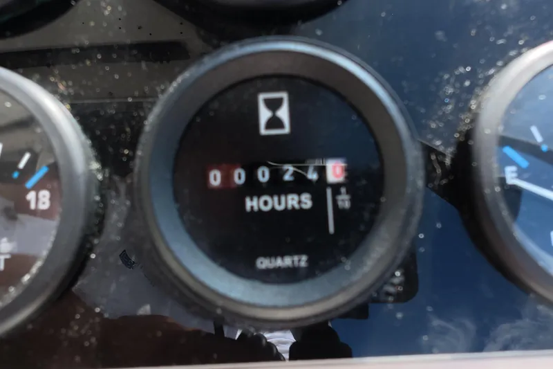 Slide: The Image of Hour meter showing 240 hours on 1992 Luhrs 300 Tournament boat dashboard. - 18