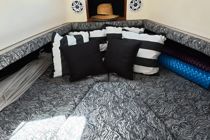 Slide: The Image of Cozy cabin interior of 1992 Luhrs 300 Tournament with striped and solid cushions. - 8