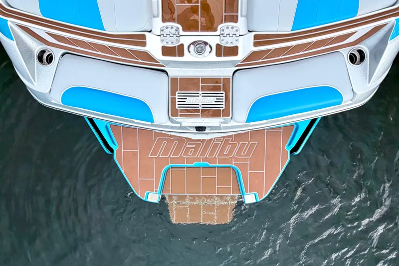 Slide: The Image of 2023 Malibu Wakesetter 23 MXZ boat stern with branded swim platform. - 11