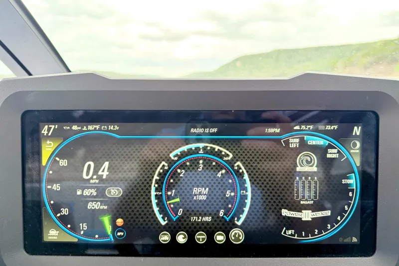 Slide: The Image of Dashboard of 2023 Malibu Wakesetter 23 MXZ showing speed, RPM, and surf settings. - 22