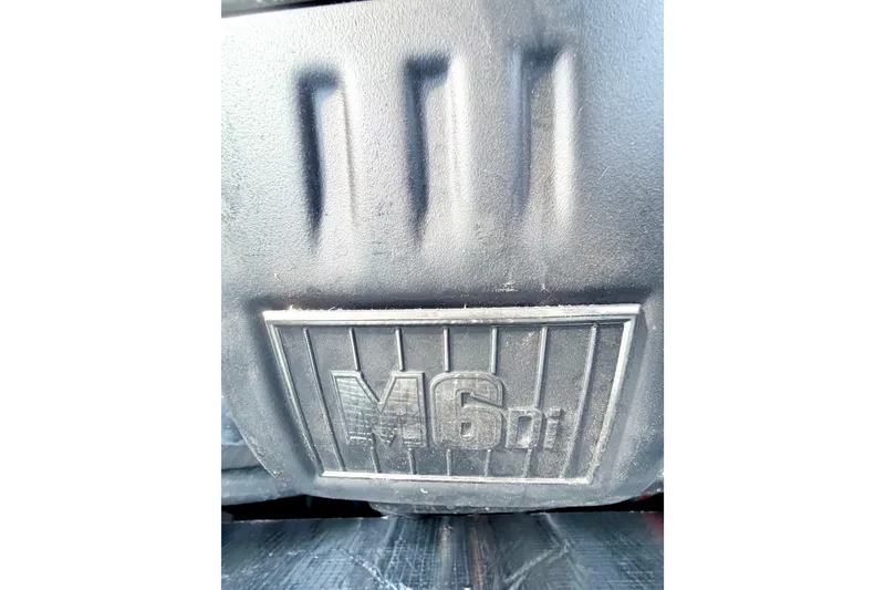 Slide: The Image of Close-up of 2023 Malibu Wakesetter 23 MXZ engine cover with "M6di" label. - 31