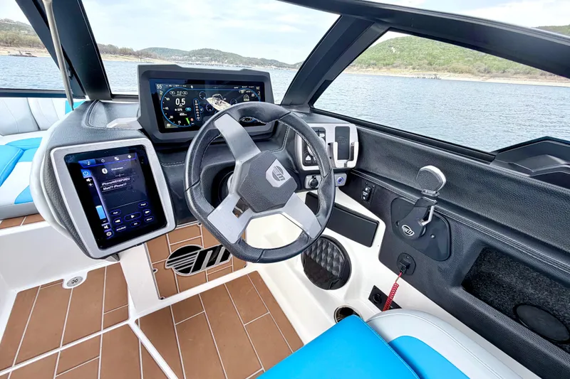 Slide: The Image of 2023 Malibu Wakesetter 23 MXZ dashboard with advanced controls and digital displays. - 36