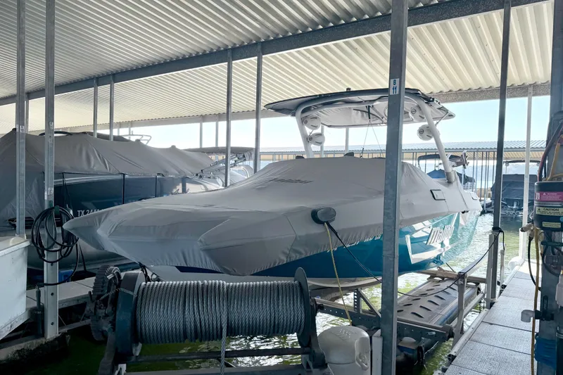 Slide: The Image of 2023 Malibu Wakesetter 23 MXZ covered in a marina dock. - 42