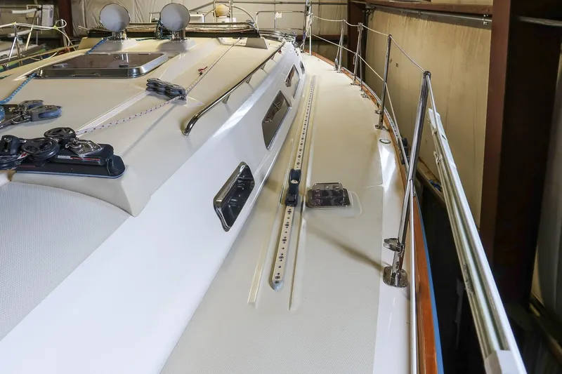 Slide: The Image of 2007 Sabre 386 yacht deck with rigging and fittings in a storage facility. - 11