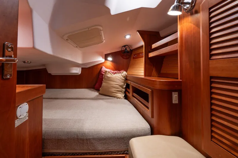 Slide: The Image of Cozy cabin interior of 2007 Sabre 386 yacht with wooden finish and comfortable bedding. - 18