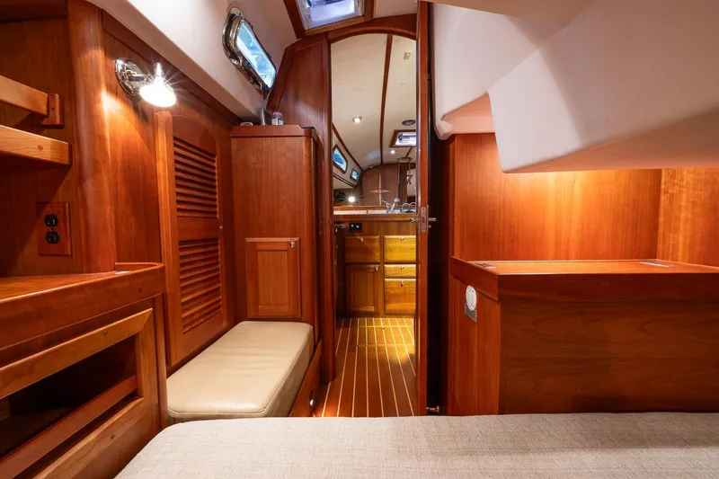 Slide: The Image of Interior of 2007 Sabre 386 yacht with wooden cabinetry and cozy seating area. - 19