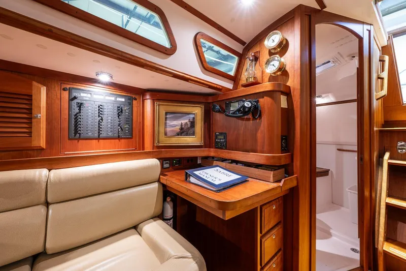 Slide: The Image of Luxurious 2007 Sabre 386 yacht interior with navigation station and elegant wood finish. - 21