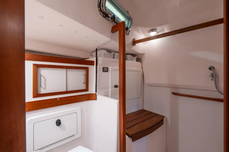 Slide: The Image of Interior of 2007 Sabre 386 sailboat bathroom with wooden accents and storage. - 22