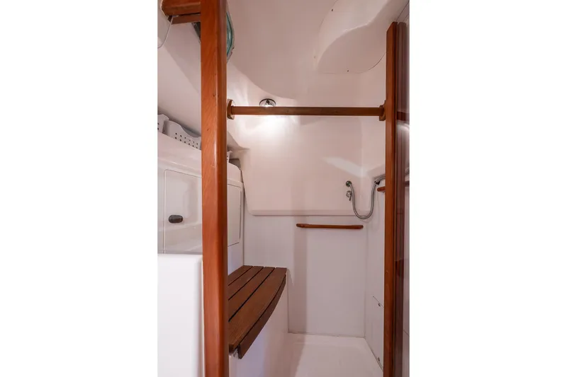 Slide: The Image of Interior of 2007 Sabre 386 yacht shower with wooden accents and modern fixtures. - 24