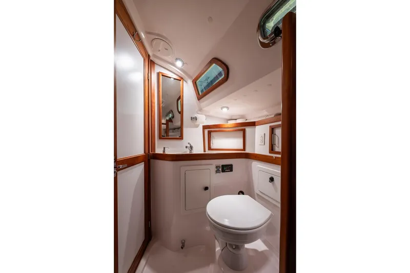 Slide: The Image of 2007 Sabre 386 yacht bathroom with wood accents and modern fixtures. - 25