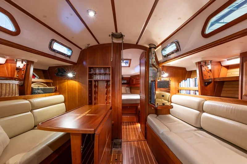 Slide: The Image of Luxurious interior of 2007 Sabre 386 yacht with wood finish and comfortable seating. - 26