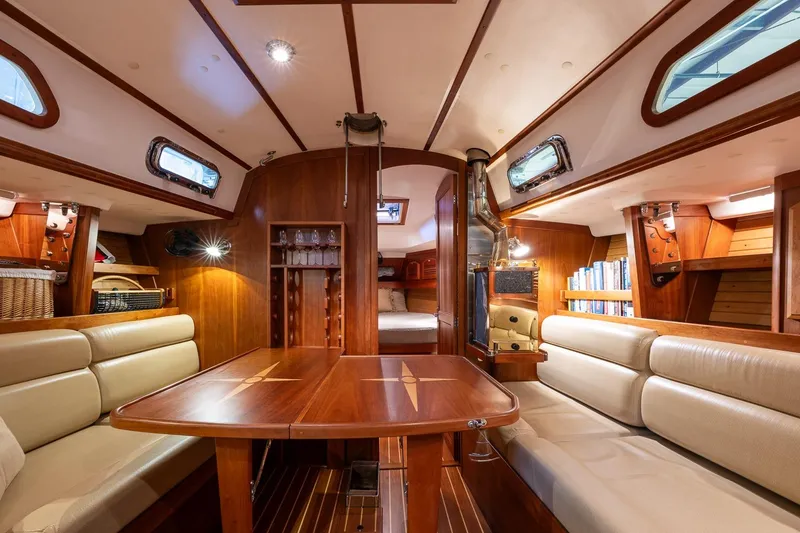 Slide: The Image of Luxurious interior of 2007 Sabre 386 sailboat with wood finish and cozy seating. - 27