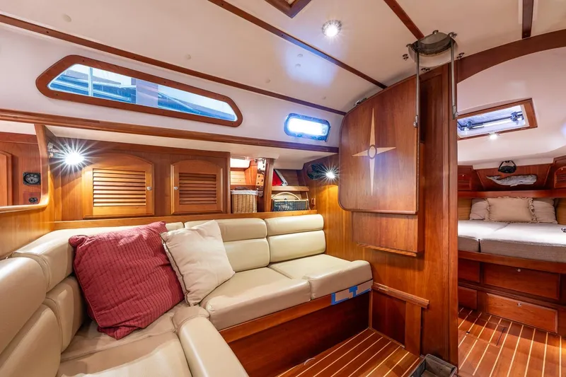 Slide: The Image of Luxurious 2007 Sabre 386 yacht interior with wooden finishes and comfortable seating. - 28