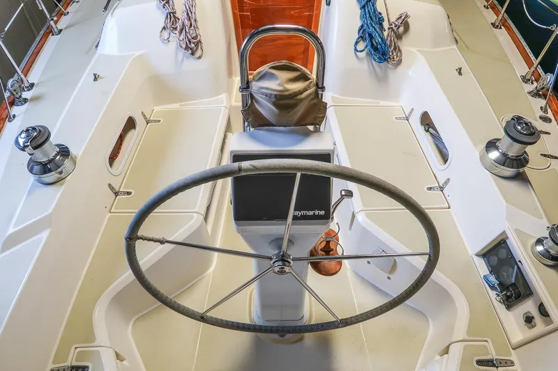 Slide: The Image of Cockpit of 2007 Sabre 386 sailboat with steering wheel and navigation equipment. - 3