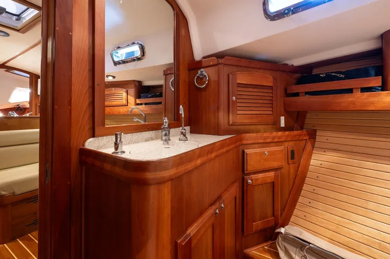 Slide: The Image of Luxurious 2007 Sabre 386 yacht interior with wooden cabinetry and modern fixtures. - 31