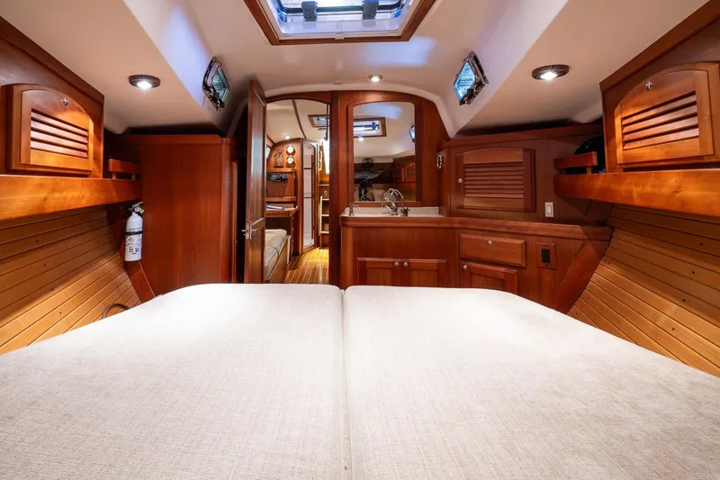 Slide: The Image of Luxurious 2007 Sabre 386 yacht interior with wood finish and cozy cabin space. - 35