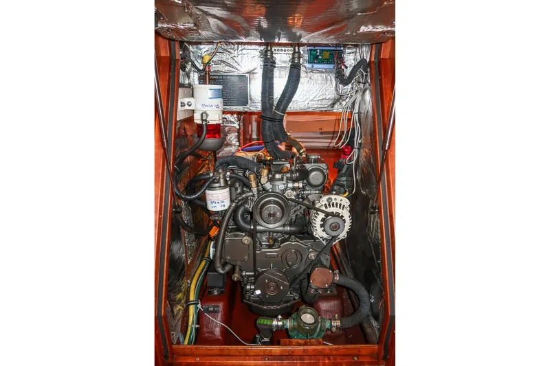 Slide: The Image of Engine compartment of a 2007 Sabre 386 sailboat, showcasing mechanical components and wiring. - 38