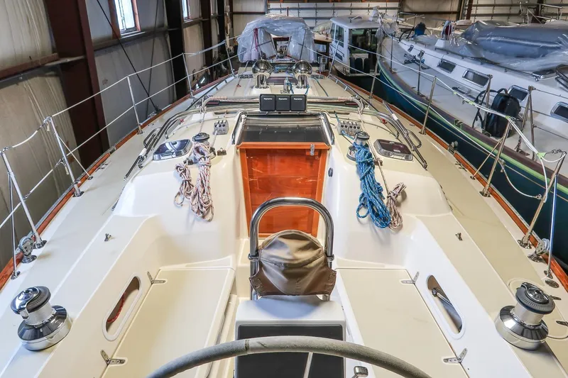 Slide: The Image of 2007 Sabre 386 sailboat interior with ropes and winches in a storage facility. - 4