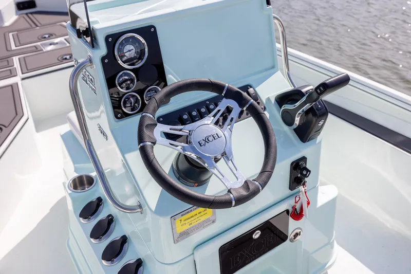 Slide: The Image of Steering console of 2026 Excel 203 Bay Pro Elite boat with gauges and controls. - 20
