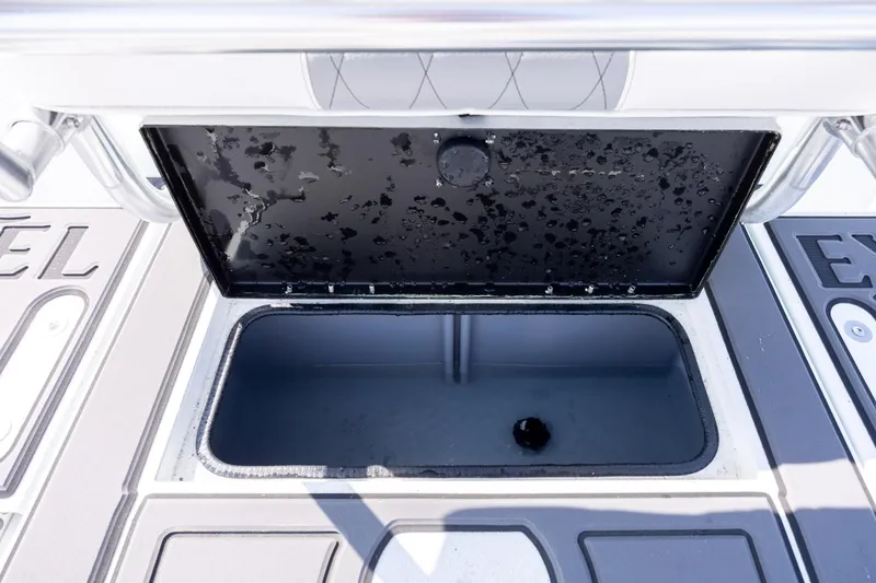 Slide: The Image of Open storage compartment on 2026 Excel 203 Bay Pro Elite boat deck. - 26