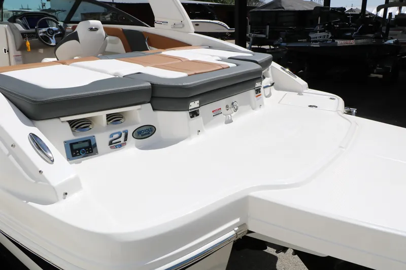 Slide: The Image of 2026 Chaparral 21 SSi boat interior with seating and control panel. - 11