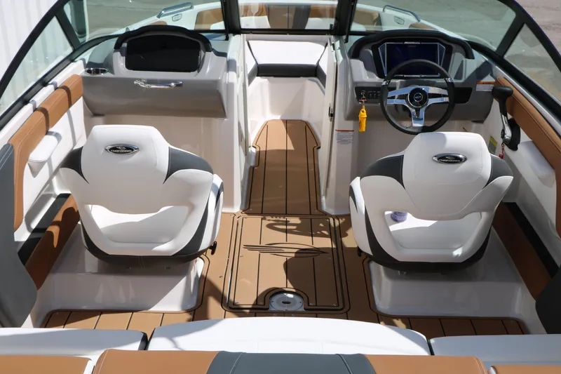 Slide: The Image of Interior of 2026 Chaparral 21 SSi boat with modern seating and steering wheel. - 18