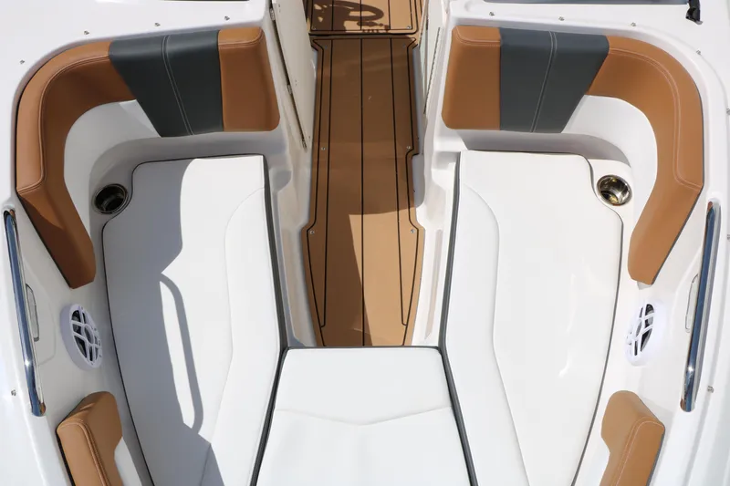 Slide: The Image of 2026 Chaparral 21 SSi boat interior with tan and gray seating, white deck. - 24
