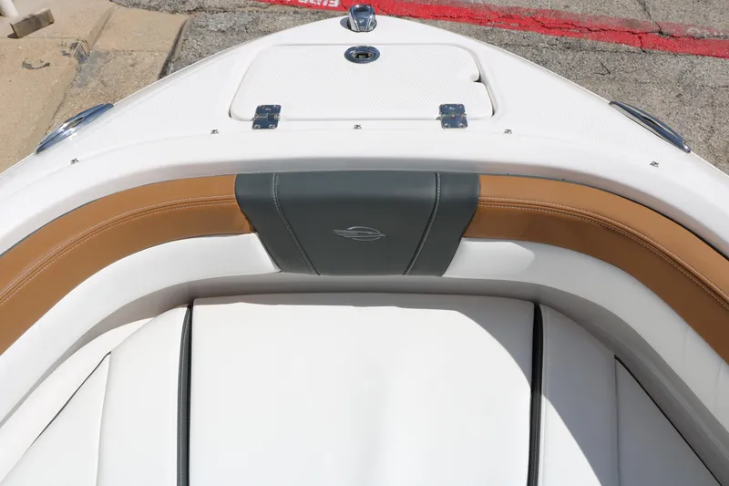 Slide: The Image of 2026 Chaparral 21 SSi boat interior with tan and white seating. - 27