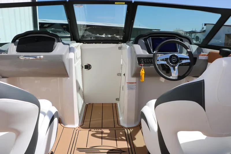 Slide: The Image of 2026 Chaparral 21 SSi boat interior with modern dashboard and steering wheel. - 31