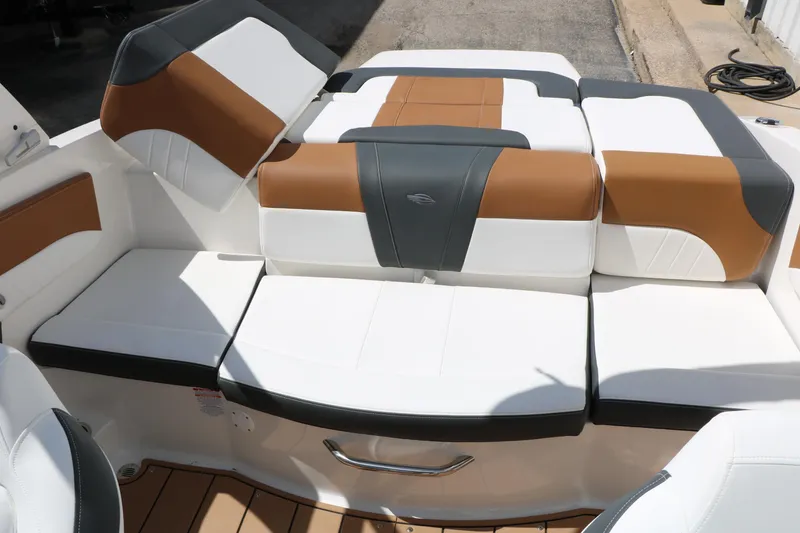 Slide: The Image of 2026 Chaparral 21 SSi boat interior with stylish white, brown, and gray seating. - 36
