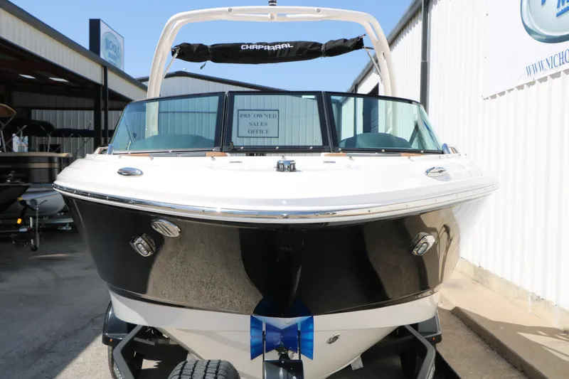 Slide: The Image of 2026 Chaparral 21 SSi boat displayed at a sales office, front view. - 4