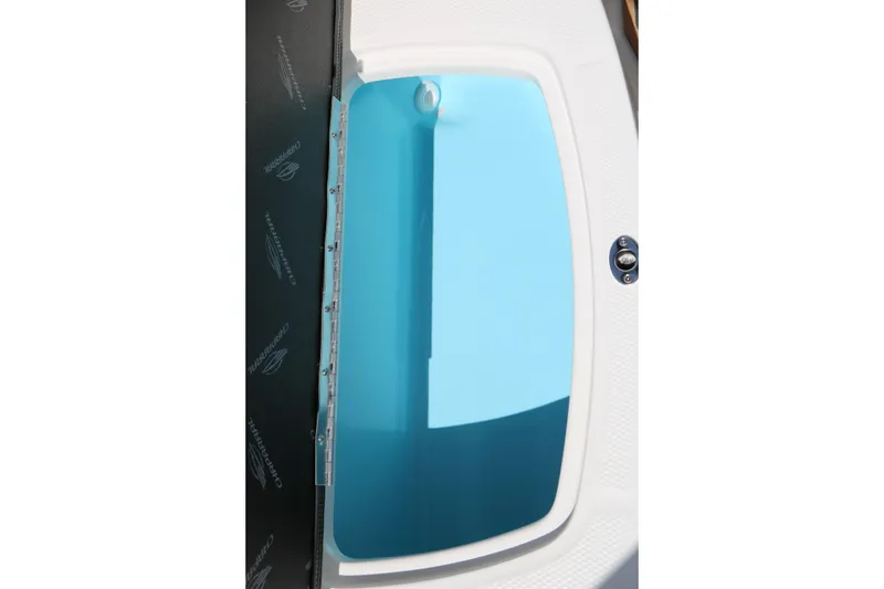 Slide: The Image of 2026 Chaparral 21 SSi boat interior detail with blue compartment. - 41