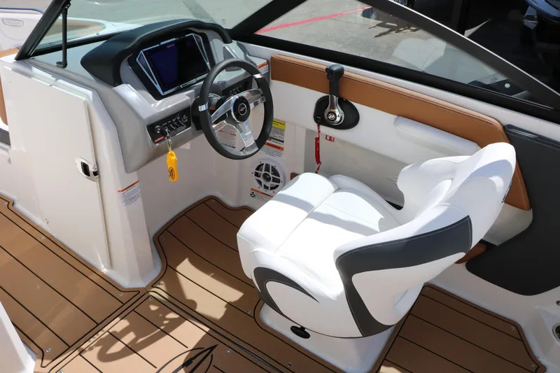 Slide: The Image of 2026 Chaparral 21 SSi boat interior with modern dashboard and comfortable seating. - 42