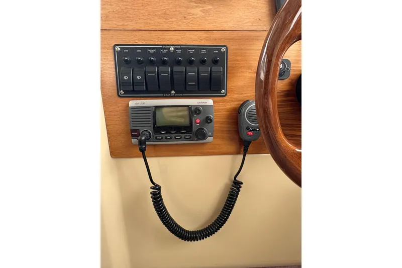 Slide: The Image of 2012 Cutwater C-26 boat dashboard with control panel and VHF radio. - 18