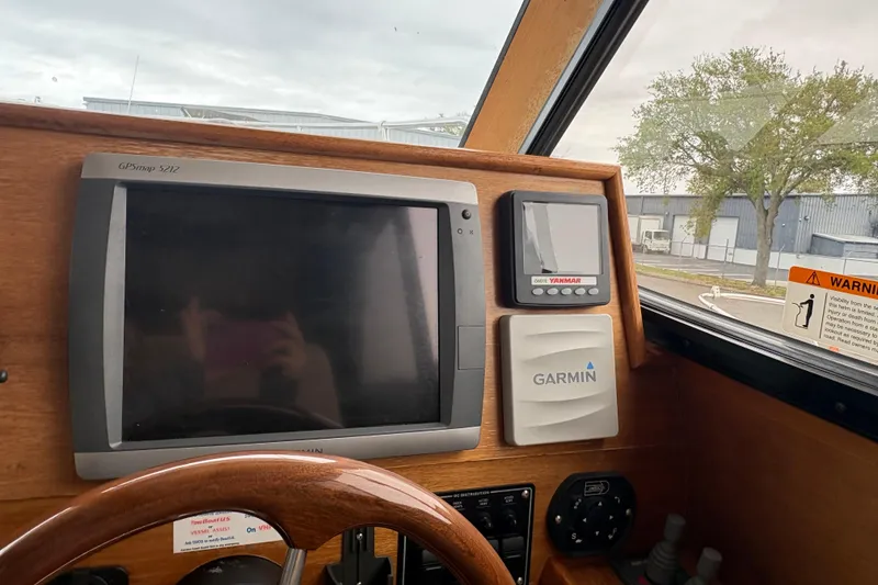 Slide: The Image of Dashboard of a 2012 Cutwater C-26 boat with Garmin navigation system. - 19