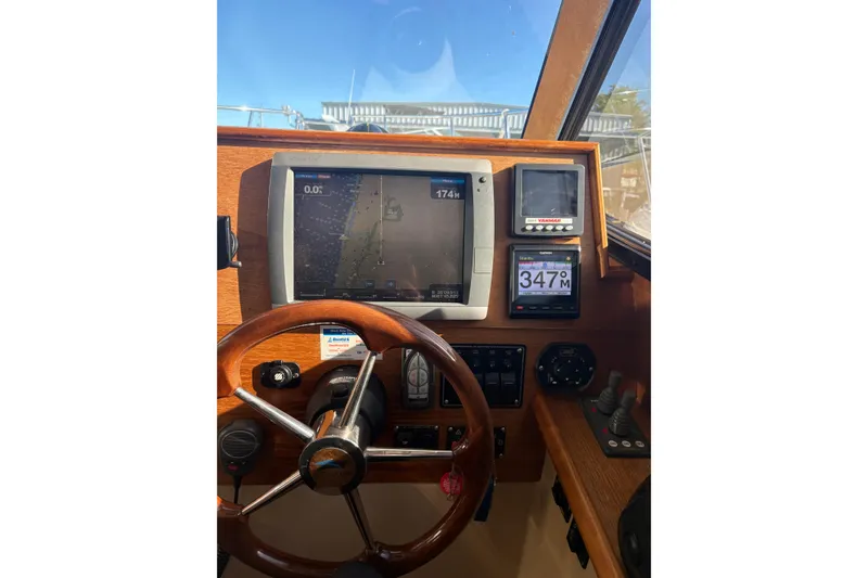 Slide: The Image of Steering wheel and navigation instruments on a 2012 Cutwater C-26 boat. - 20