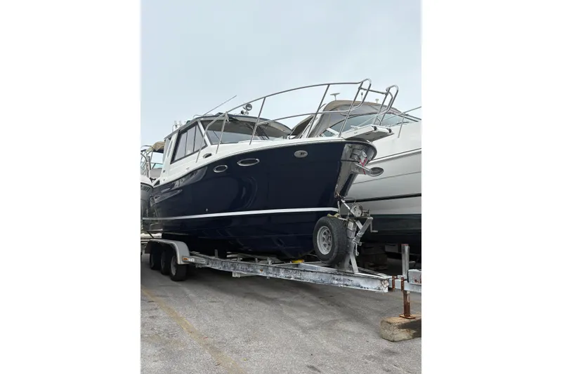 Slide: The Image of 2012 Cutwater C-26 boat on trailer, parked in a marina. - 5