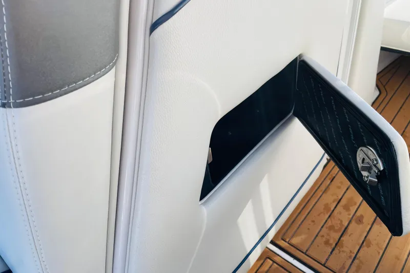 Slide: The Image of 2015 Nautique Super Air Nautique G23 interior storage compartment with open door. - 26