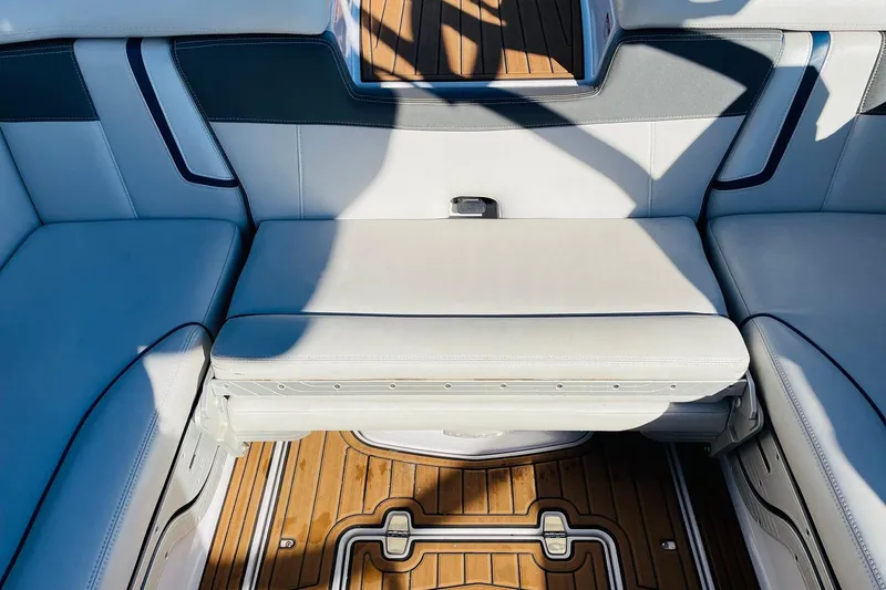 Slide: The Image of 2015 Nautique Super Air Nautique G23 interior seating with teak flooring. - 39