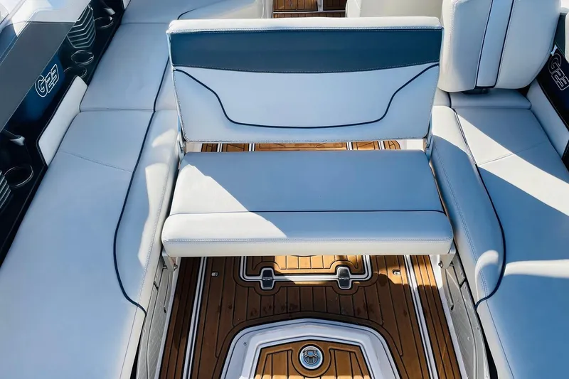 Slide: The Image of 2015 Nautique Super Air Nautique G23 interior with white seating and teak flooring. - 42