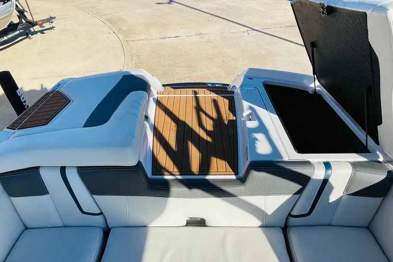 Slide: The Image of 2015 Nautique Super Air Nautique G23 boat interior with open storage compartment. - 48