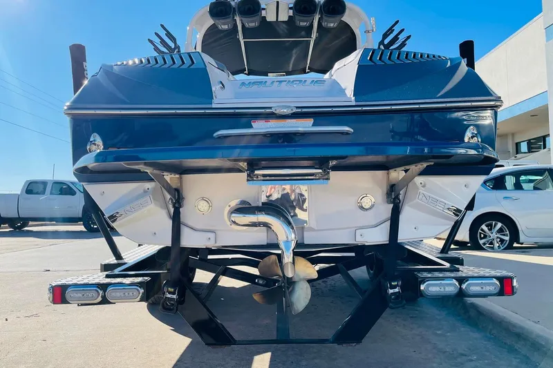 Slide: The Image of 2015 Nautique Super Air Nautique G23 boat rear view on trailer. - 5