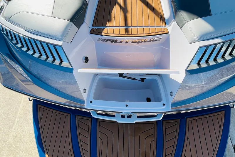 Slide: The Image of 2015 Nautique Super Air Nautique G23 boat deck with seating and storage compartment. - 52