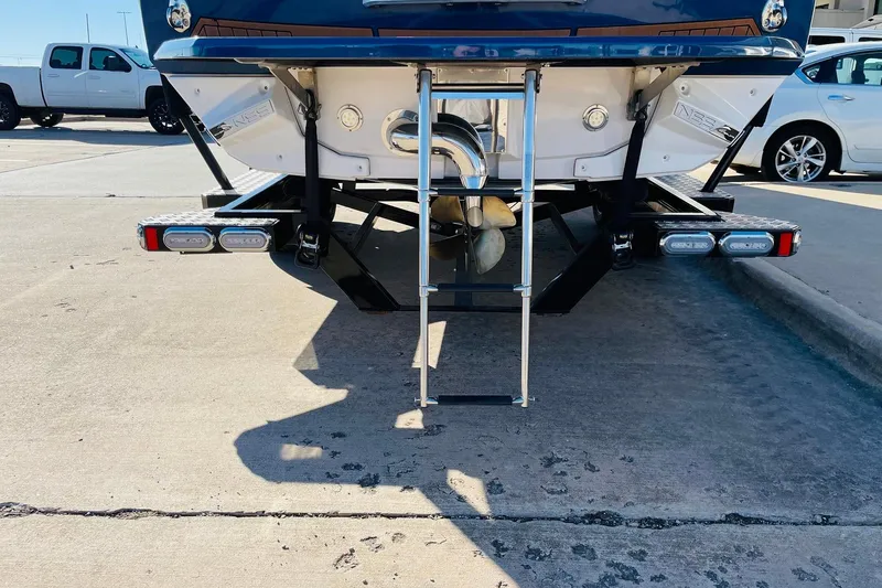 Slide: The Image of Rear view of 2015 Nautique Super Air Nautique G23 boat with ladder and propeller. - 6