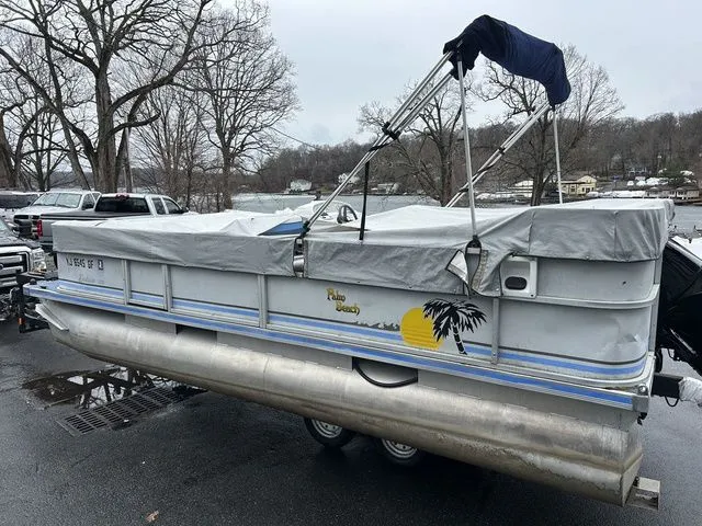 Slide: The Image of 1998 Palm Beach 200 pontoon boat on a trailer. - 16