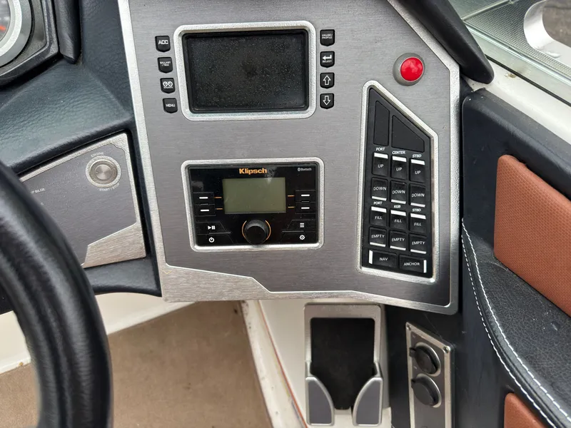 Slide: The Image of Dashboard of a 2018 MasterCraft XT 20 boat with Klipsch audio system. - 12